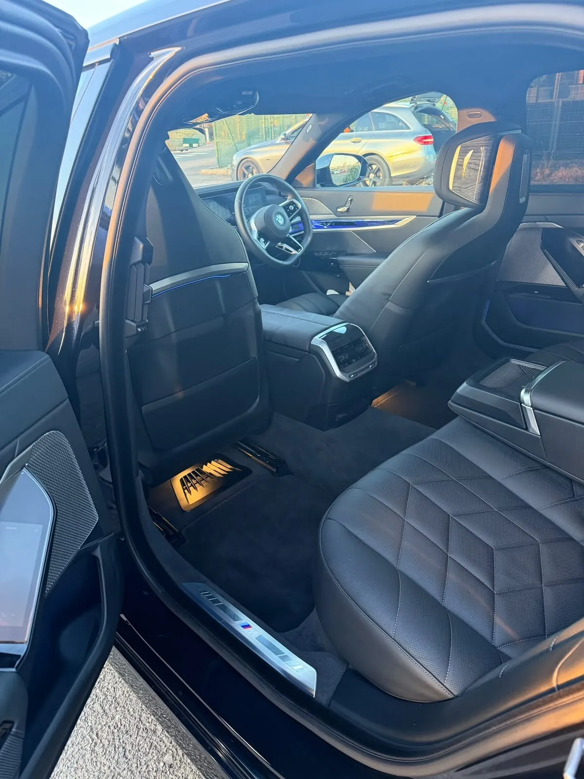 Rear door open on the BMW i7, ready for the passenger
